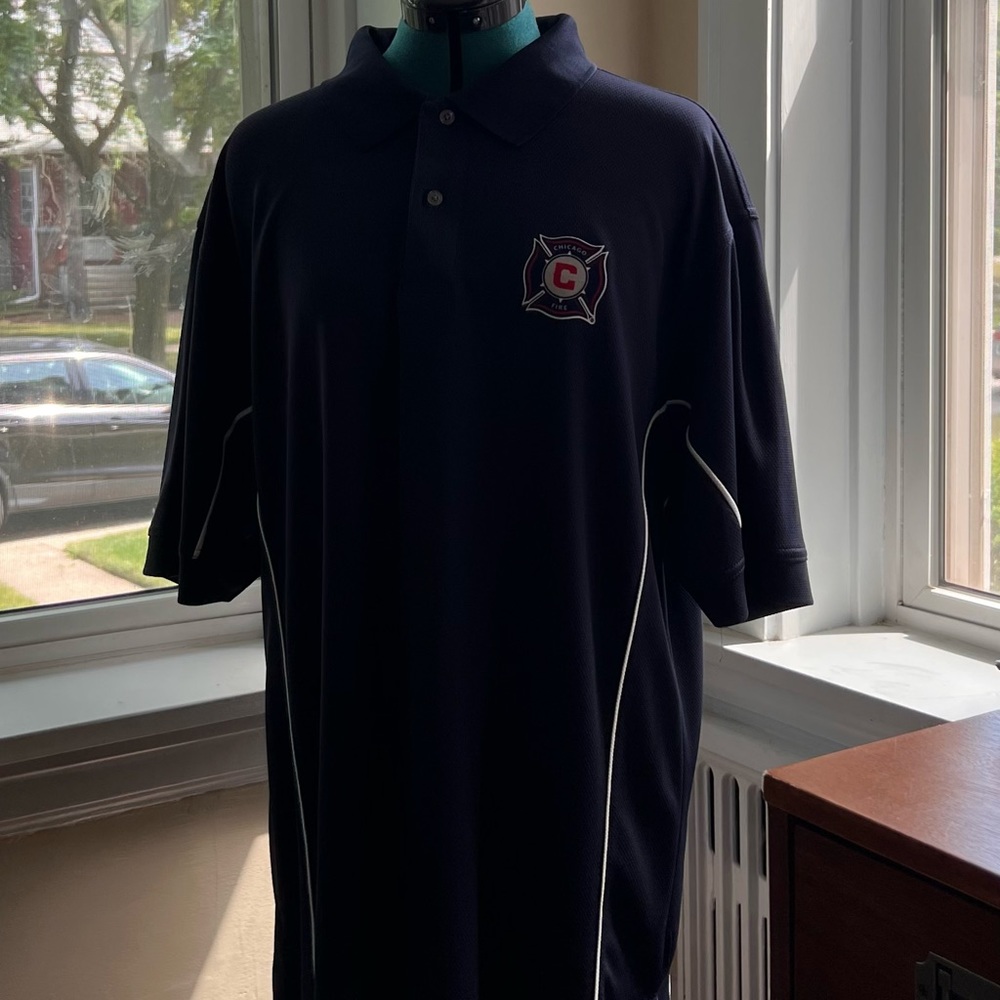 PGA tour navy blue mens golf shirt with Chicago Fire soccer logo on front. XL